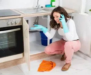 Woman alking over the phone about sink issue
