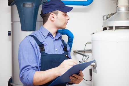 Man inspecting a heating system