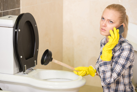 Woman calling for a plumber